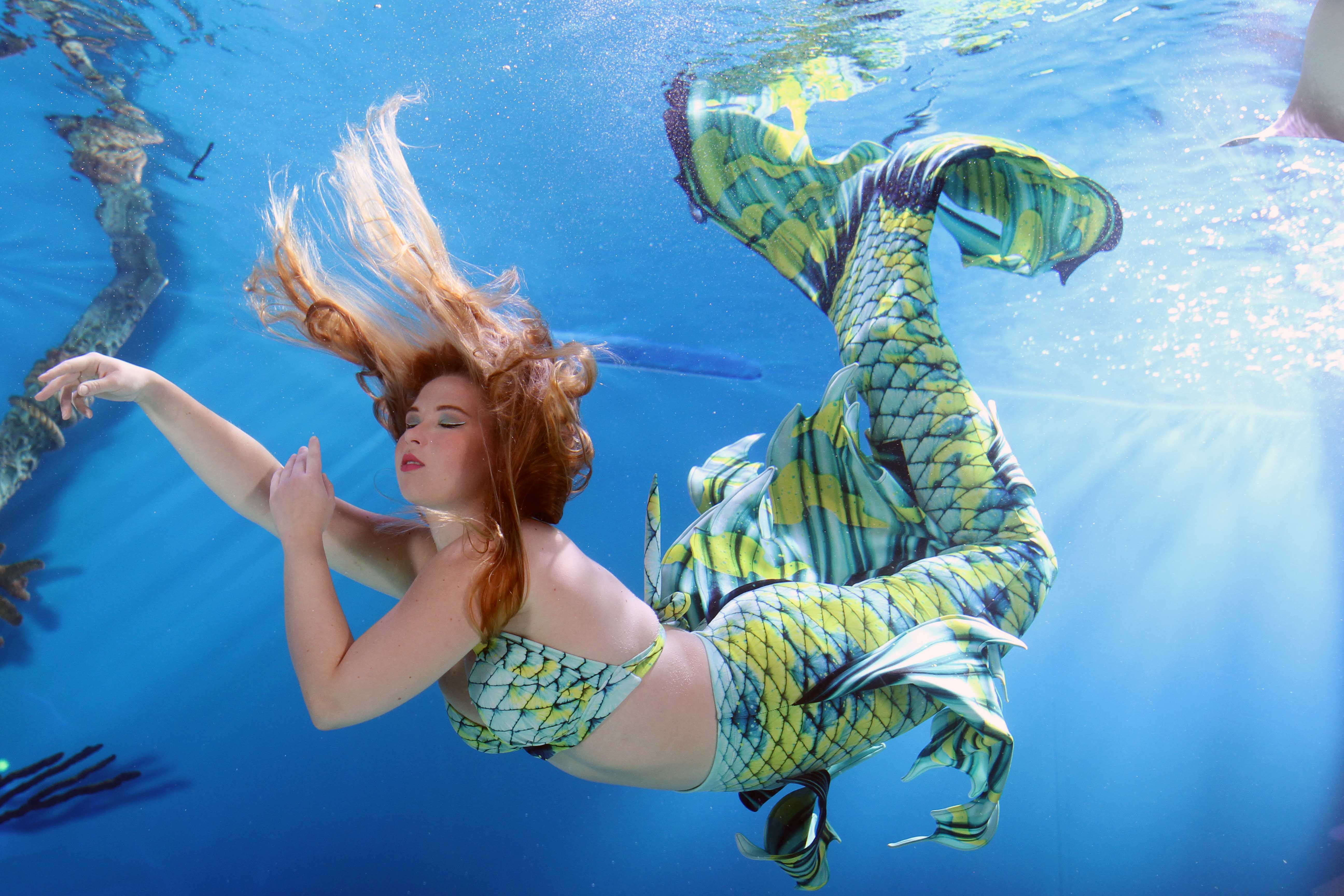 Student practicing advanced mermaid skills with instructor